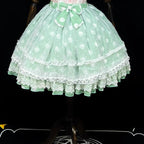This sweet Lolita skirt combines vibrant red, green and orange hues in a playful summer design. The elastic waist ensures comfortable flexibility while layered chiffon and mesh create dynamic texture. Delicate bow accents add classic Lolita charm to this short skirt silhouette. Perfect for creating sweet or classic coordinates, this lightweight skirt offers effortless movement and timeless elegance. The cheerful color palette makes it ideal for seasonal celebrations and everyday fantasy wear.