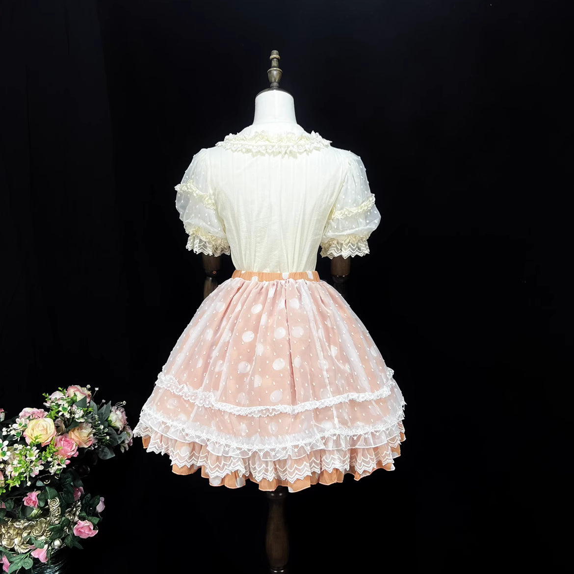 This sweet Lolita skirt combines vibrant red, green and orange hues in a playful summer design. The elastic waist ensures comfortable flexibility while layered chiffon and mesh create dynamic texture. Delicate bow accents add classic Lolita charm to this short skirt silhouette. Perfect for creating sweet or classic coordinates, this lightweight skirt offers effortless movement and timeless elegance. The cheerful color palette makes it ideal for seasonal celebrations and everyday fantasy wear.