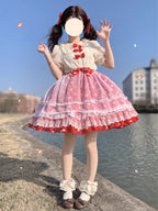 This sweet Lolita skirt combines vibrant red, green and orange hues in a playful summer design. The elastic waist ensures comfortable flexibility while layered chiffon and mesh create dynamic texture. Delicate bow accents add classic Lolita charm to this short skirt silhouette. Perfect for creating sweet or classic coordinates, this lightweight skirt offers effortless movement and timeless elegance. The cheerful color palette makes it ideal for seasonal celebrations and everyday fantasy wear.