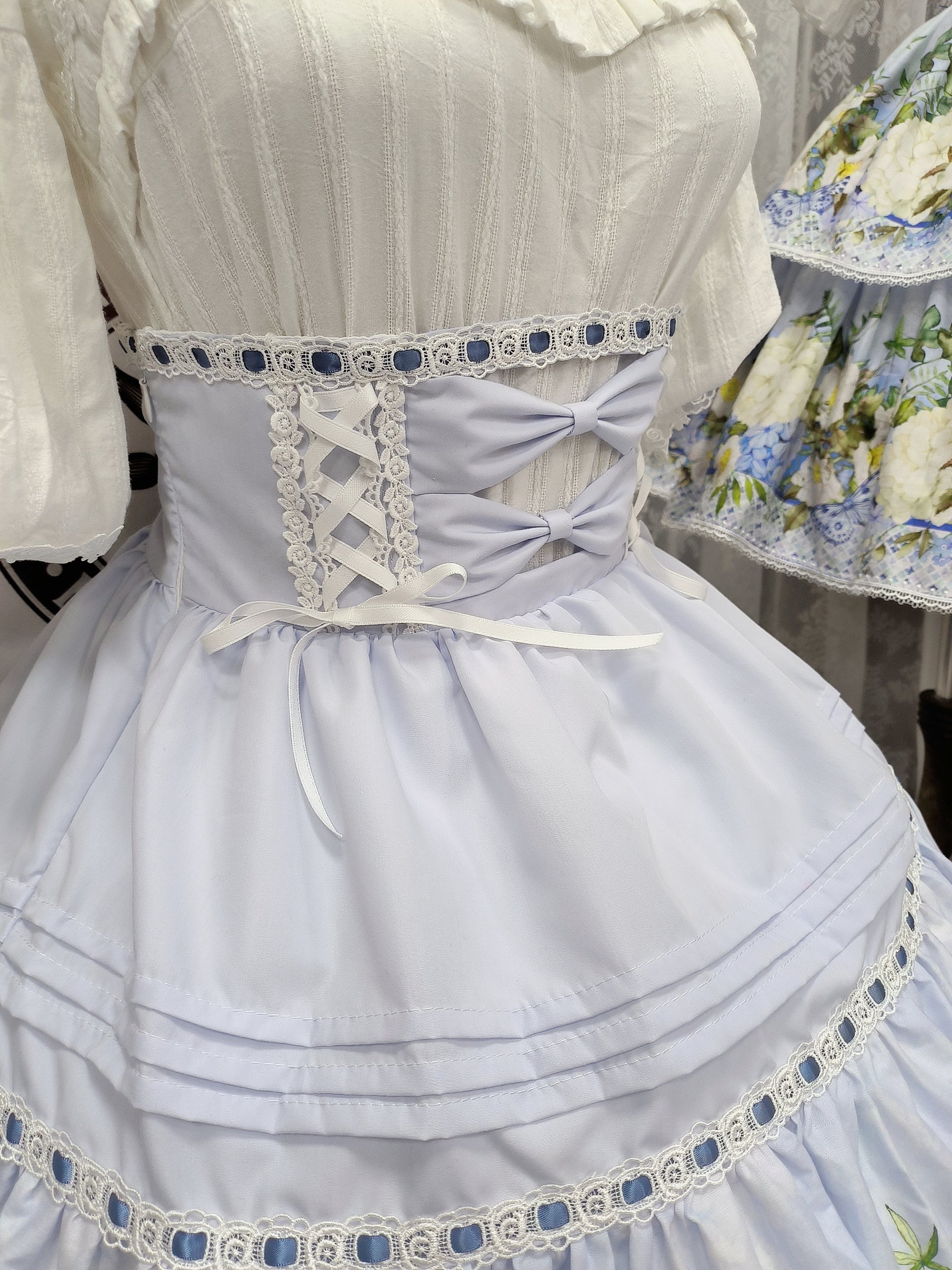 Bloom into elegance with this floral Lolita skirt, where vintage-inspired blossoms dance across a graceful A-line silhouette. The high-waist design accentuates your figure while the layered construction creates a light, airy volume perfect for spring gatherings. Delicate碎花印花 evokes the romance of a secret garden, crafted from premium fabric for both structure and comfort. Ideal for tea parties, garden events, or adding a touch of whimsy to everyday wear, this skirt celebrates the timeless beauty of nature t