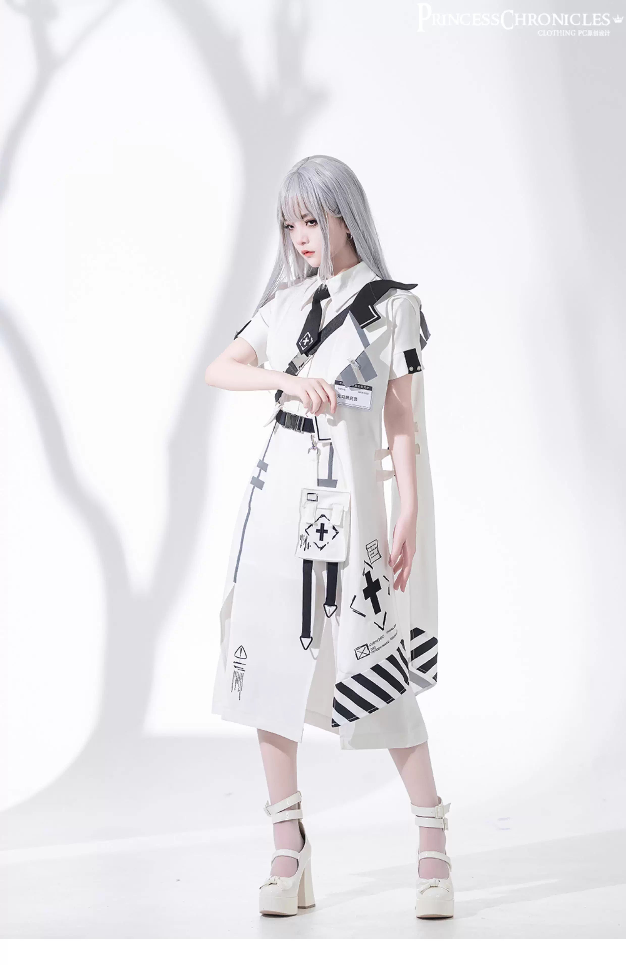 Blending Lolita’s delicate silhouette with techwear’s utilitarian edge, this skirt features asymmetric layered tiers, modular attachment points, and hidden pockets. The crisp white fabric contrasts with tactical straps and geometric seams, creating a fusion of poetic softness and cyberpunk functionality. Designed for dynamic movement and layered styling, it embodies a future where elegance meets rebellion.