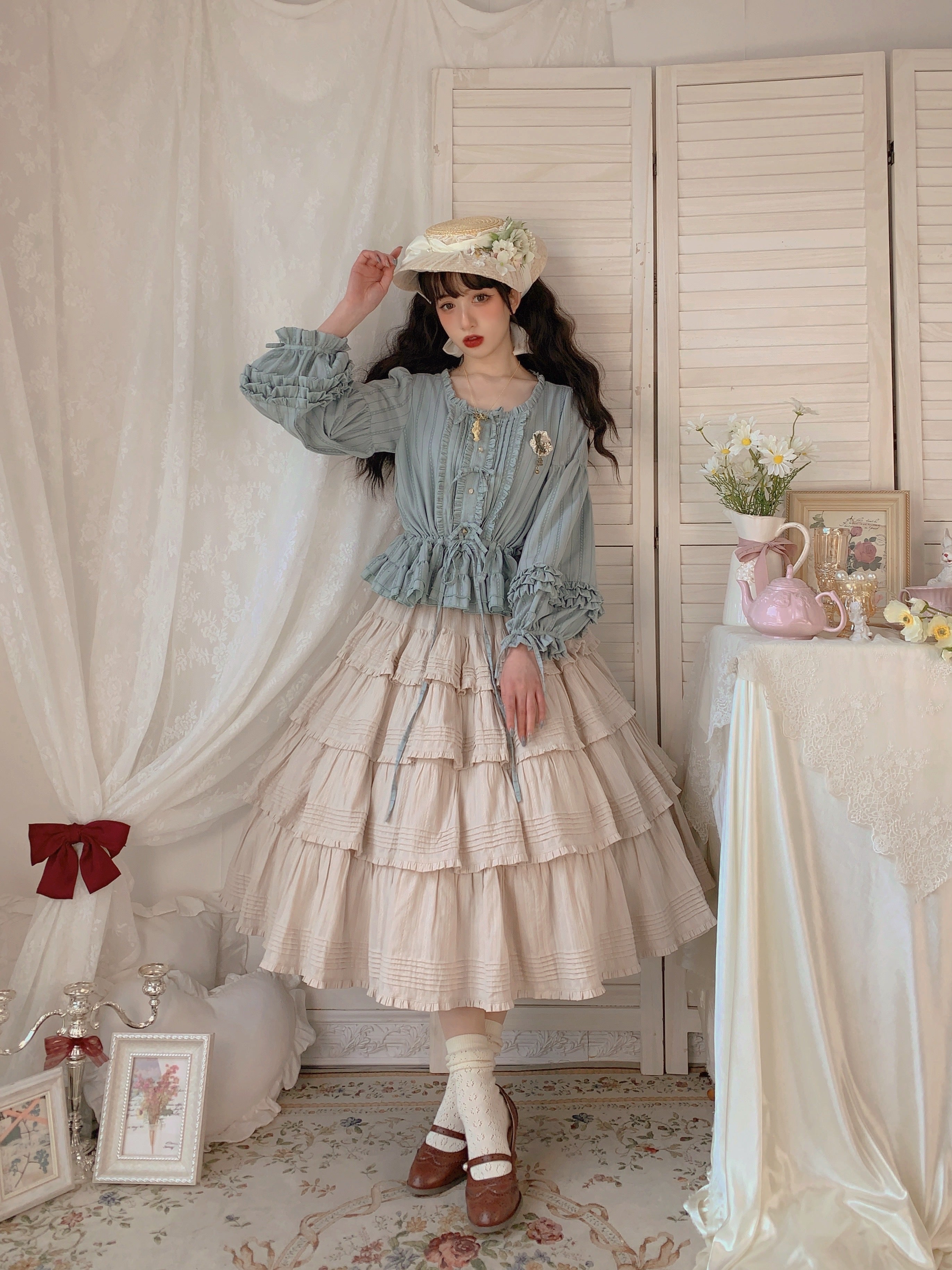 Embrace rustic charm with this Heidi-inspired cottagecore Lolita skirt, crafted from premium heavy cotton for structured elegance. Meticulous embroidery and delicate trims adorn its flowing silhouette, echoing the whimsy of alpine meadows and storybook dreams. Designed for layering or standalone wear, this skirt offers versatility and timeless appeal. Available in multiple nature-inspired hues, it effortlessly complements blouses or JSKs for a pastoral yet polished coordinate. Perfect for tea parties, garde