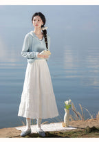 The Lazy Days Cake Skirt is designed to embody effortless elegance and comfort. Its namesake A-line silhouette, flaring gently from the hips, recalls the soft, delightful layers of a cake. Crafted from a premium, flowy fabric, it offers beautiful movement. The elevated midi length and versatile design are intentionally created to flatter the petite frame, providing a timeless piece that seamlessly transitions from a casual day out to a more polished autumn ensemble.