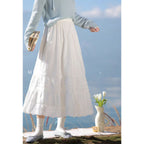 The Lazy Days Cake Skirt is designed to embody effortless elegance and comfort. Its namesake A-line silhouette, flaring gently from the hips, recalls the soft, delightful layers of a cake. Crafted from a premium, flowy fabric, it offers beautiful movement. The elevated midi length and versatile design are intentionally created to flatter the petite frame, providing a timeless piece that seamlessly transitions from a casual day out to a more polished autumn ensemble.