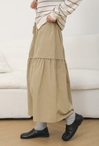 The Muse Society A-line skirt combines minimalist elegance with thoughtful design. The high-waisted cut and strategic pleating work to flatter your silhouette, effortlessly smoothing the waist and hips for a slimming effect. Crafted from a soft, breathable cotton-blend fabric, it ensures all-day comfort. This versatile skirt is designed to be a timeless, ageless staple in your wardrobe, perfect for creating a chic and polished look that transitions seamlessly across seasons.