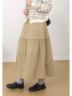 The Muse Society A-line skirt combines minimalist elegance with thoughtful design. The high-waisted cut and strategic pleating work to flatter your silhouette, effortlessly smoothing the waist and hips for a slimming effect. Crafted from a soft, breathable cotton-blend fabric, it ensures all-day comfort. This versatile skirt is designed to be a timeless, ageless staple in your wardrobe, perfect for creating a chic and polished look that transitions seamlessly across seasons.