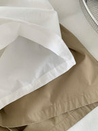 The Muse Society A-line skirt combines minimalist elegance with thoughtful design. The high-waisted cut and strategic pleating work to flatter your silhouette, effortlessly smoothing the waist and hips for a slimming effect. Crafted from a soft, breathable cotton-blend fabric, it ensures all-day comfort. This versatile skirt is designed to be a timeless, ageless staple in your wardrobe, perfect for creating a chic and polished look that transitions seamlessly across seasons.