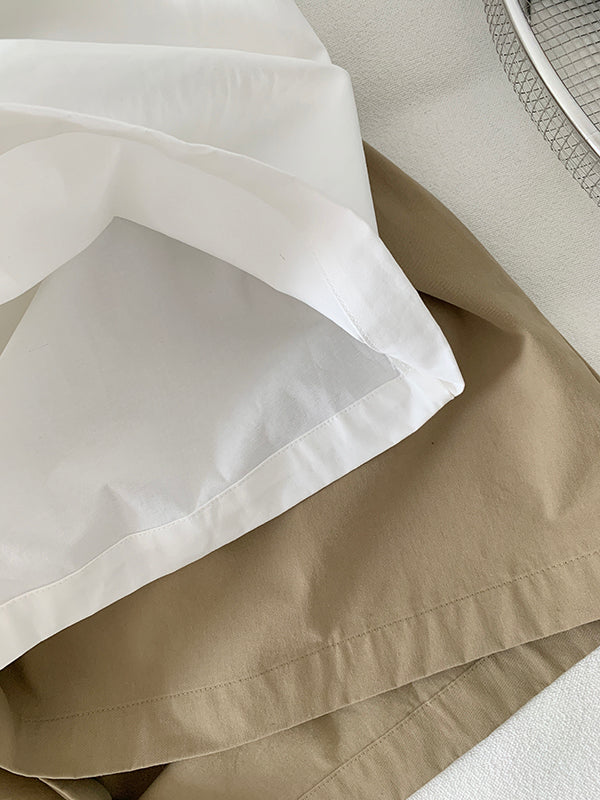 The Muse Society A-line skirt combines minimalist elegance with thoughtful design. The high-waisted cut and strategic pleating work to flatter your silhouette, effortlessly smoothing the waist and hips for a slimming effect. Crafted from a soft, breathable cotton-blend fabric, it ensures all-day comfort. This versatile skirt is designed to be a timeless, ageless staple in your wardrobe, perfect for creating a chic and polished look that transitions seamlessly across seasons.