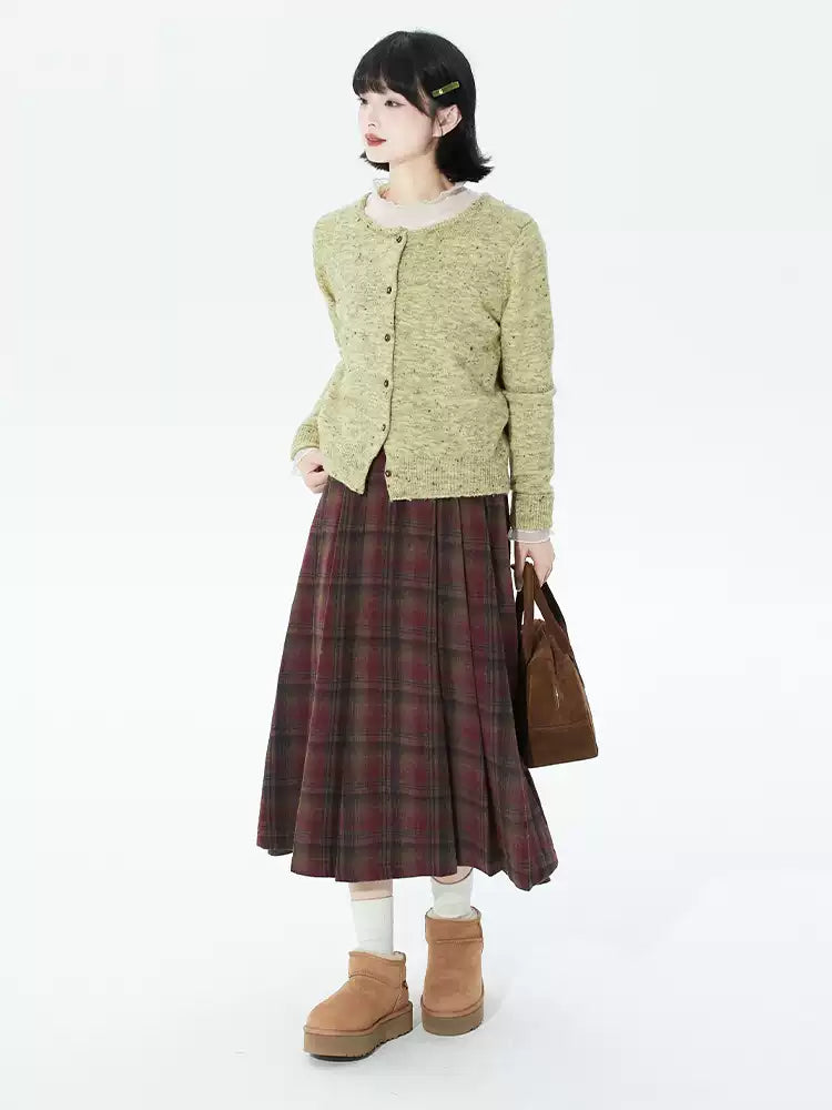 Embrace autumn’s warmth with this vintage-inspired red tartan skirt, crafted from soft wool blend fabric for cozy comfort. The classic A-line silhouette and gentle pleats create a flattering, relaxed fit, while the midi length adds timeless elegance. Perfect for pairing with sweaters or blouses, this skirt blends rustic charm with refined versatility. Ideal for crisp fall days, holiday gatherings, or adding a touch of nostalgic romance to your wardrobe. Designed for both style and substance, it invites you 