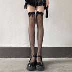 Designed for the daring and elegant, these black Gothic socks blend seduction with sophistication. The over-the-knee length and wide cuff create a striking silhouette, while intricate lace and fishnet detailing add texture and allure. Perfect for completing a bold Lolita or Gothic coord, these socks empower wearers to embrace their darkly romantic side. Crafted for both style and statement, they transform any outfit into a masterpiece of dramatic elegance.