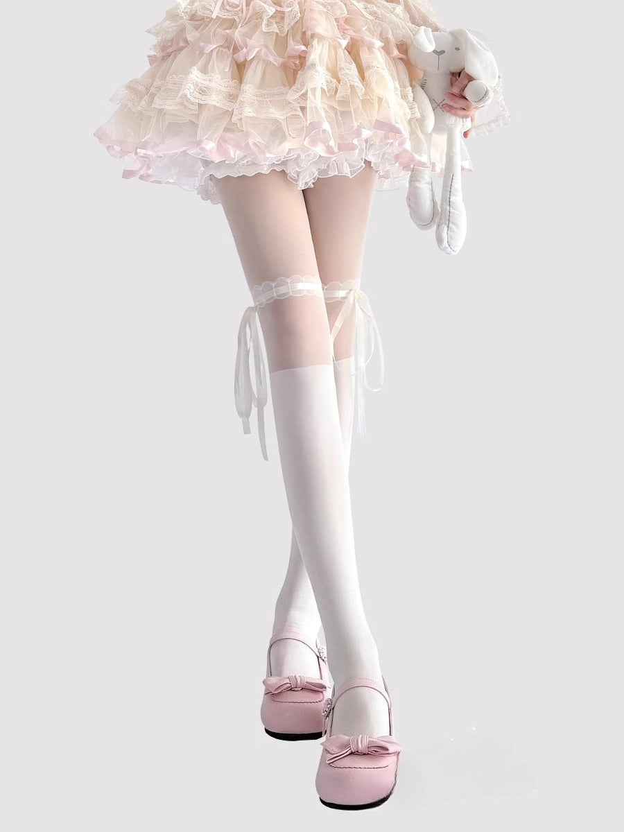 These Lolita-style tights are crafted in classic black and ivory, featuring delicate lace trims and charming bow accents. The sheer, ballet-inspired design adds a soft, elegant touch to any outfit, perfectly complementing Sweet Lolita dresses and skirts. Comfortable and lightweight, they are ideal for daily wear, tea parties, or special Lolita gatherings, enhancing the overall princess-like aesthetic of your ensemble.