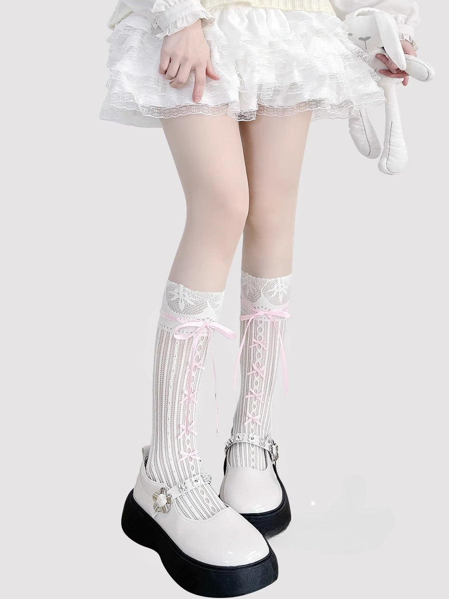 Inspired by the delicate elegance of ballet and vintage Lolita fashion, these mid-calf socks blend romance with playful charm. Sheer cream fabric adorned with intricate lace and a dainty bow tie detail creates a soft, feminine aesthetic. Perfect for pairing with Mary Jane shoes, they capture the timeless innocence of balletcore style while offering lightweight comfort for summer wear.