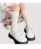 Inspired by the delicate elegance of ballet and vintage Lolita fashion, these mid-calf socks blend romance with playful charm. Sheer cream fabric adorned with intricate lace and a dainty bow tie detail creates a soft, feminine aesthetic. Perfect for pairing with Mary Jane shoes, they capture the timeless innocence of balletcore style while offering lightweight comfort for summer wear.