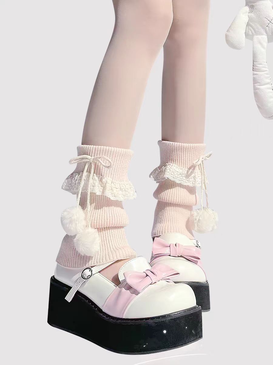 Inspired by the cozy kawaii aesthetics of Japanese street fashion, these knit leg warmers blend playful charm with winter comfort. The delicate lace trim, fluffy pompom details, and soft cream-pink color palette evoke a sweet Lolita vibe. Perfect for layering in fall and winter, they add a touch of dreamy elegance to any outfit while keeping you warm and stylish.