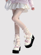 Inspired by the cozy kawaii aesthetics of Japanese street fashion, these knit leg warmers blend playful charm with winter comfort. The delicate lace trim, fluffy pompom details, and soft cream-pink color palette evoke a sweet Lolita vibe. Perfect for layering in fall and winter, they add a touch of dreamy elegance to any outfit while keeping you warm and stylish.