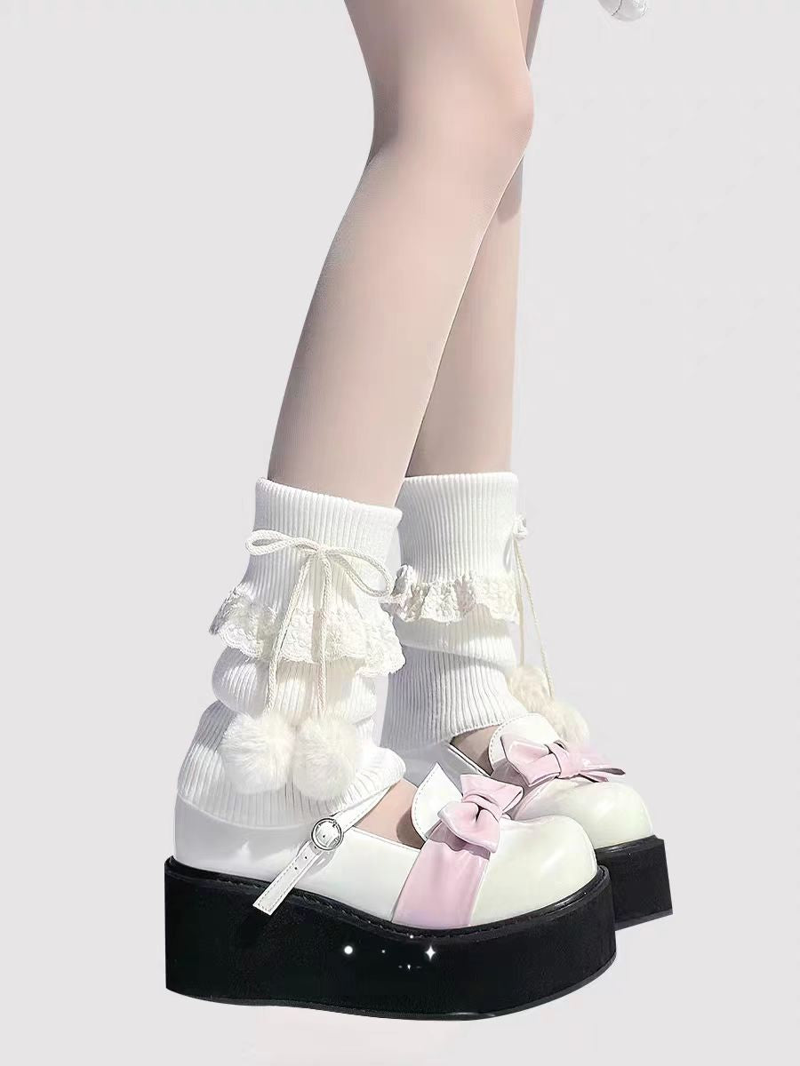 Inspired by the cozy kawaii aesthetics of Japanese street fashion, these knit leg warmers blend playful charm with winter comfort. The delicate lace trim, fluffy pompom details, and soft cream-pink color palette evoke a sweet Lolita vibe. Perfect for layering in fall and winter, they add a touch of dreamy elegance to any outfit while keeping you warm and stylish.