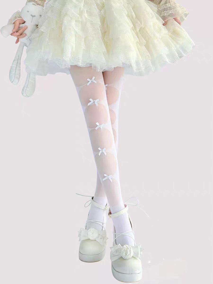Inspired by the delicate charm of Lolita fashion, these cream-colored tights blend elegance with practicality. Featuring a subtle bow detail and ultra-sheer lightweight fabric, they offer a perfect summer layering piece. The snag-resistant construction ensures durability, while the soft cream hue adds a touch of romantic innocence to any Lolita coordinate. Designed for both beauty and everyday wear.