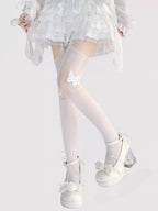 Designed for the bold and glamorous, these fishnet tights redefine edgy elegance. Delicate butterfly motifs adorned with sparkling rhinestones create a striking contrast against the sheer net fabric. The intricate strappy design and lace detailing add a touch of provocative sophistication, perfect for making a statement night out or elevating any daring fashion ensemble. Confidence woven into every thread.