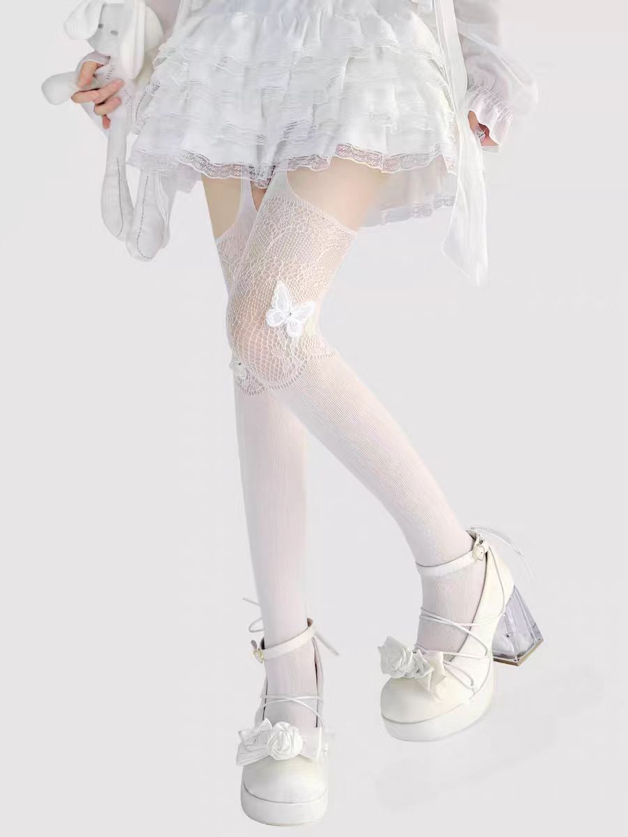 Designed for the bold and glamorous, these fishnet tights redefine edgy elegance. Delicate butterfly motifs adorned with sparkling rhinestones create a striking contrast against the sheer net fabric. The intricate strappy design and lace detailing add a touch of provocative sophistication, perfect for making a statement night out or elevating any daring fashion ensemble. Confidence woven into every thread.