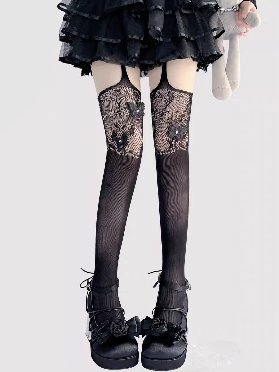 Designed for the bold and glamorous, these fishnet tights redefine edgy elegance. Delicate butterfly motifs adorned with sparkling rhinestones create a striking contrast against the sheer net fabric. The intricate strappy design and lace detailing add a touch of provocative sophistication, perfect for making a statement night out or elevating any daring fashion ensemble. Confidence woven into every thread.