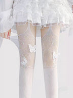 Designed for the bold and glamorous, these fishnet tights redefine edgy elegance. Delicate butterfly motifs adorned with sparkling rhinestones create a striking contrast against the sheer net fabric. The intricate strappy design and lace detailing add a touch of provocative sophistication, perfect for making a statement night out or elevating any daring fashion ensemble. Confidence woven into every thread.