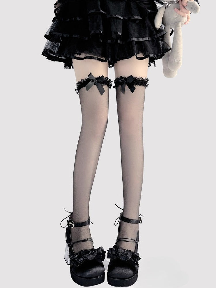 Design Concept:
These Lolita-style over-the-knee stockings are crafted in sheer black and white fabric, featuring delicate bow accents at the top for a playful yet elegant touch. The semi-transparent material adds a subtle allure while maintaining a sweet Lolita aesthetic, making them perfect for daily wear, tea parties, or special occasions. The soft stretch ensures a comfortable fit that stays in place all day.