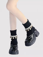 Inspired by Japanese school fashion and winter coziness, these knit leg warmers combine playful charm with warmth. The soft cream color, fluffy pom-pom detail, and fold-over fringe design create a sweet, nostalgic aesthetic. Perfect for pairing with JK uniforms or casual outfits, they offer both style and comfort during the chilly seasons.