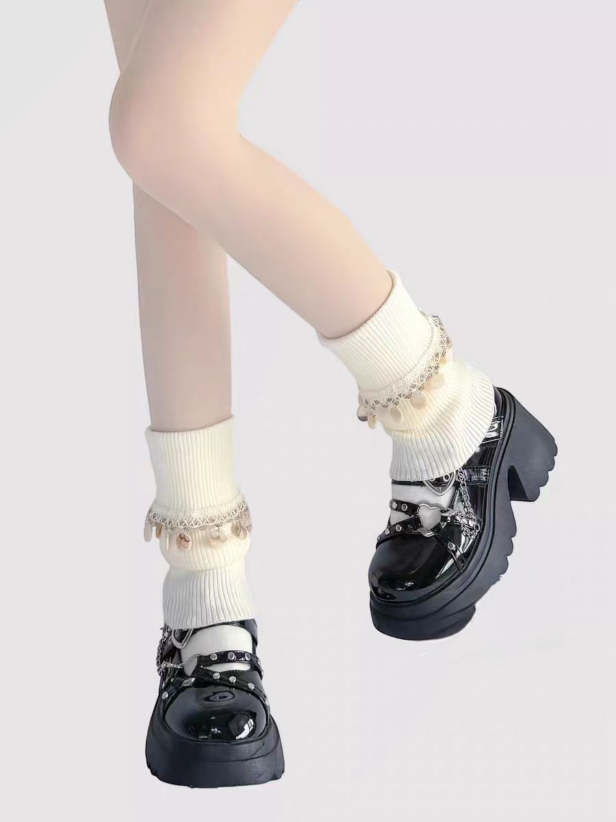Inspired by Japanese school fashion and winter coziness, these knit leg warmers combine playful charm with warmth. The soft cream color, fluffy pom-pom detail, and fold-over fringe design create a sweet, nostalgic aesthetic. Perfect for pairing with JK uniforms or casual outfits, they offer both style and comfort during the chilly seasons.