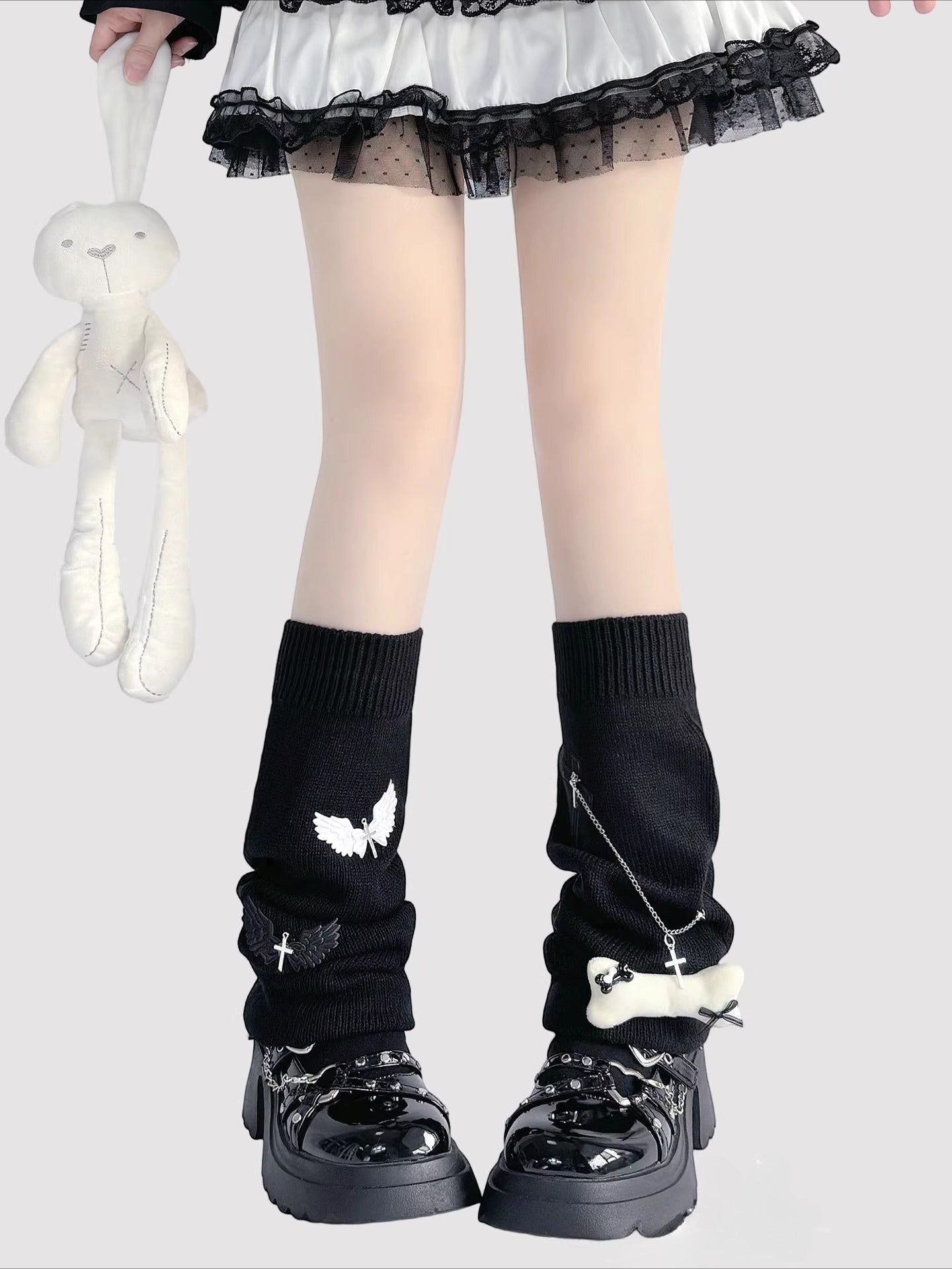 Design Concept:
These Lolita Stockings in off-white and black feature a playful Y2K-inspired winged design, crafted from soft knit for warmth and comfort. The knee-high style with a slightly slouchy fit adds a cute and edgy touch to your outfit, perfect for autumn and winter styling or layering with skirts and dresses. Each pair measures approximately 23cm in length, making them a versatile accessory for daily wear, tea parties, or themed Lolita looks.