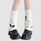 Design Concept:
These Lolita Stockings in off-white and black feature a playful Y2K-inspired winged design, crafted from soft knit for warmth and comfort. The knee-high style with a slightly slouchy fit adds a cute and edgy touch to your outfit, perfect for autumn and winter styling or layering with skirts and dresses. Each pair measures approximately 23cm in length, making them a versatile accessory for daily wear, tea parties, or themed Lolita looks.