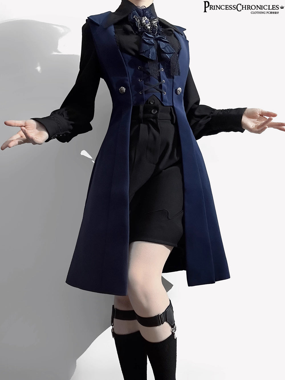 Inspired by midnight sonatas and medieval armor, this long vest merges dark romance with sharp tailoring. The deep blue hue evokes twilight mystery, while structured seams and a slim silhouette create a modern yet timeless profile. Crafted from heavy-duty twill with subtle metallic hardware, it layers over blouses or dresses to transform any outfit into a narrative of shadowy elegance and poetic rebellion.