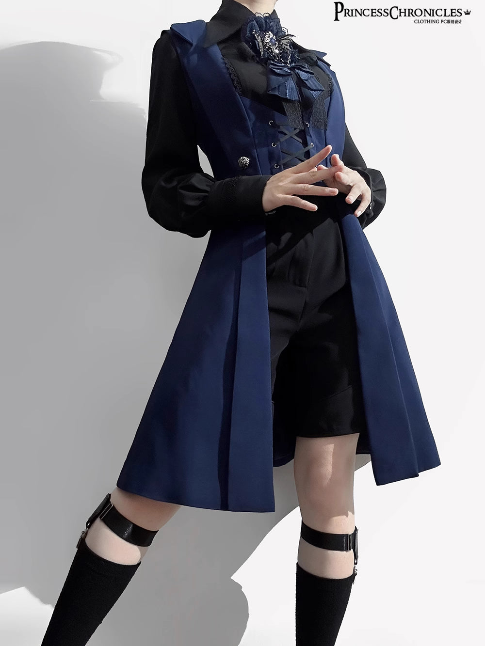 Inspired by midnight sonatas and medieval armor, this long vest merges dark romance with sharp tailoring. The deep blue hue evokes twilight mystery, while structured seams and a slim silhouette create a modern yet timeless profile. Crafted from heavy-duty twill with subtle metallic hardware, it layers over blouses or dresses to transform any outfit into a narrative of shadowy elegance and poetic rebellion.