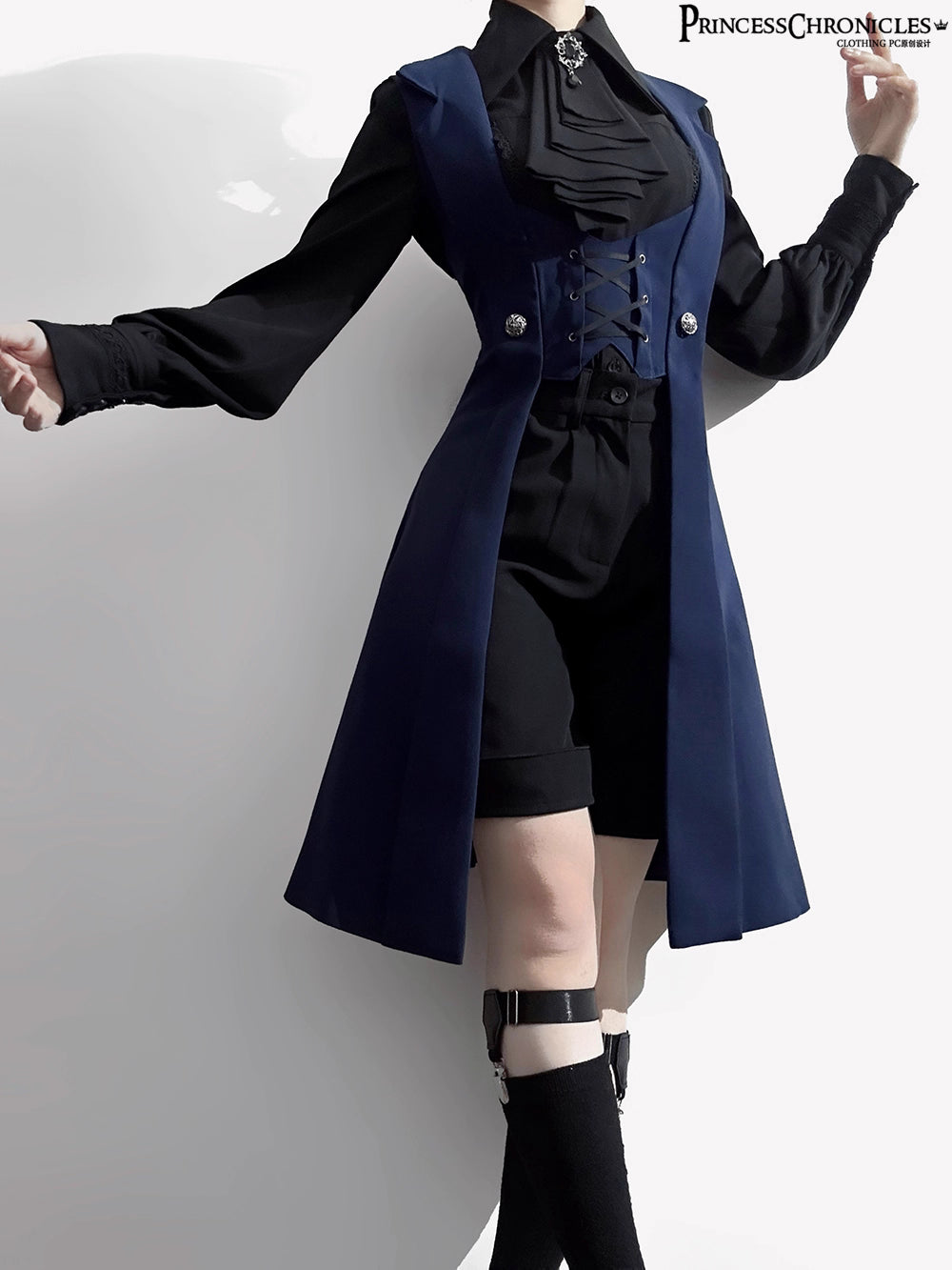 Inspired by midnight sonatas and medieval armor, this long vest merges dark romance with sharp tailoring. The deep blue hue evokes twilight mystery, while structured seams and a slim silhouette create a modern yet timeless profile. Crafted from heavy-duty twill with subtle metallic hardware, it layers over blouses or dresses to transform any outfit into a narrative of shadowy elegance and poetic rebellion.