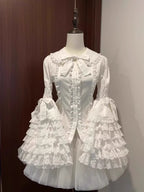 Inspired by antique porcelain dolls and Victorian elegance, this blouse features dramatic gigot sleeves, delicate lace trim, and a tailored yet forgiving fit. The ivory and black color options evoke timeless sophistication, while lightweight fabric ensures comfort. Designed to layer under jumperskirts or wear standalone, it celebrates opulent nostalgia with modern inclusivity. Perfect for creating a poetic, romantic silhouette.