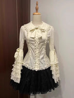 Inspired by antique porcelain dolls and Victorian elegance, this blouse features dramatic gigot sleeves, delicate lace trim, and a tailored yet forgiving fit. The ivory and black color options evoke timeless sophistication, while lightweight fabric ensures comfort. Designed to layer under jumperskirts or wear standalone, it celebrates opulent nostalgia with modern inclusivity. Perfect for creating a poetic, romantic silhouette.