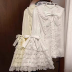 Inspired by antique porcelain dolls and Victorian elegance, this blouse features dramatic gigot sleeves, delicate lace trim, and a tailored yet forgiving fit. The ivory and black color options evoke timeless sophistication, while lightweight fabric ensures comfort. Designed to layer under jumperskirts or wear standalone, it celebrates opulent nostalgia with modern inclusivity. Perfect for creating a poetic, romantic silhouette.