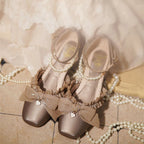 Inspired by the opulence of 19th-century Victorian soirées and the delicate artistry of heirloom jewelry, these shoes embody timeless romance. Each detail—from the lustrous pearls to the intricate lace ribbons—evokes a narrative of elegance and grace, designed for those who believe fashion is a preserved art form
