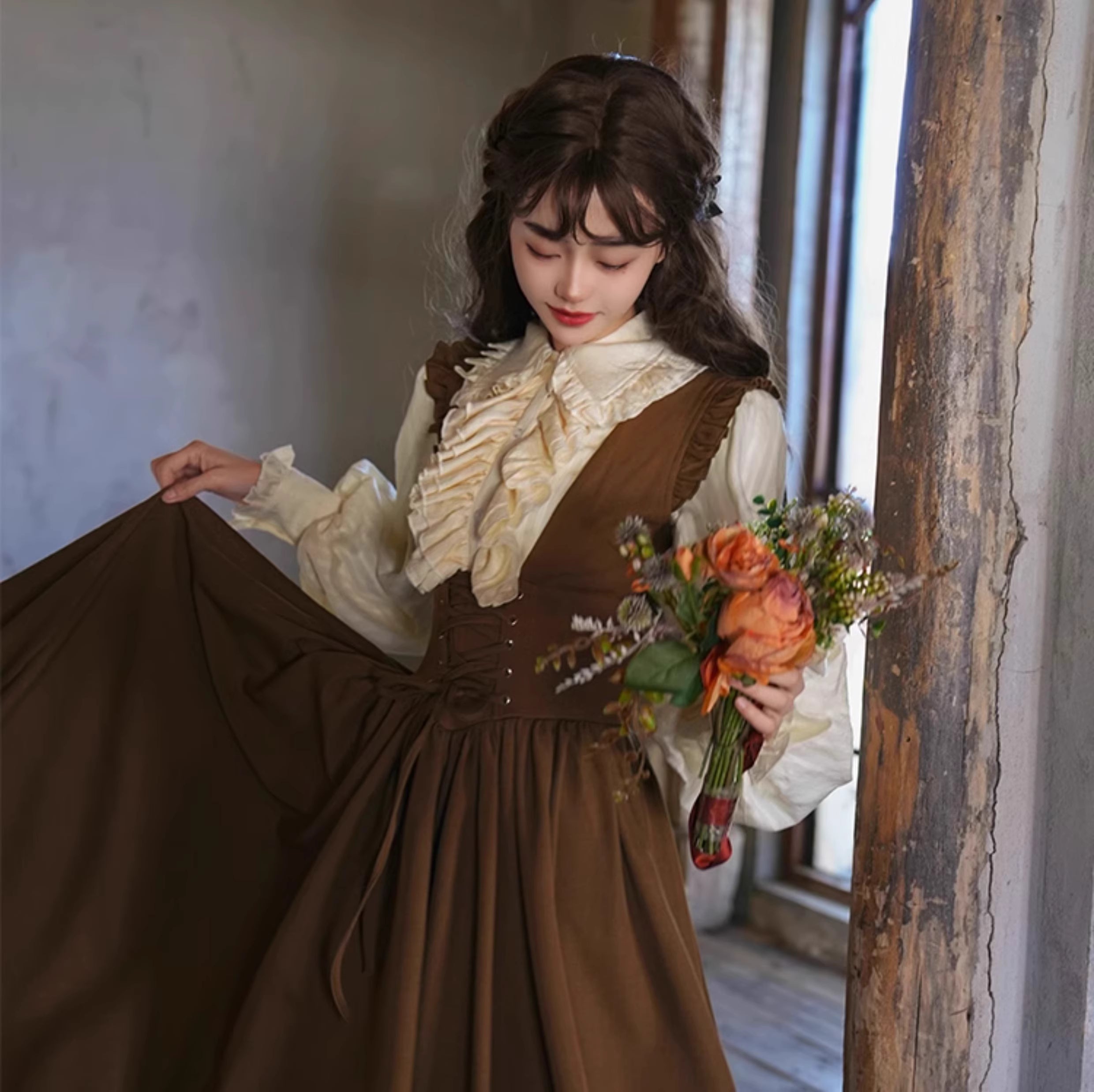 Inspired by a classic Bavarian dirndl, this dress captures the charming essence of a vintage French pastry. Crafted in a warm brown hue, it features a flattering corset-style bodice with a lace-up tie detail. The full, swingy A-line skirt offers a dramatic, playful movement, perfect for embracing the romantic and whimsical spirit of spring. This piece is for the woman who adores timeless, storybook elegance.