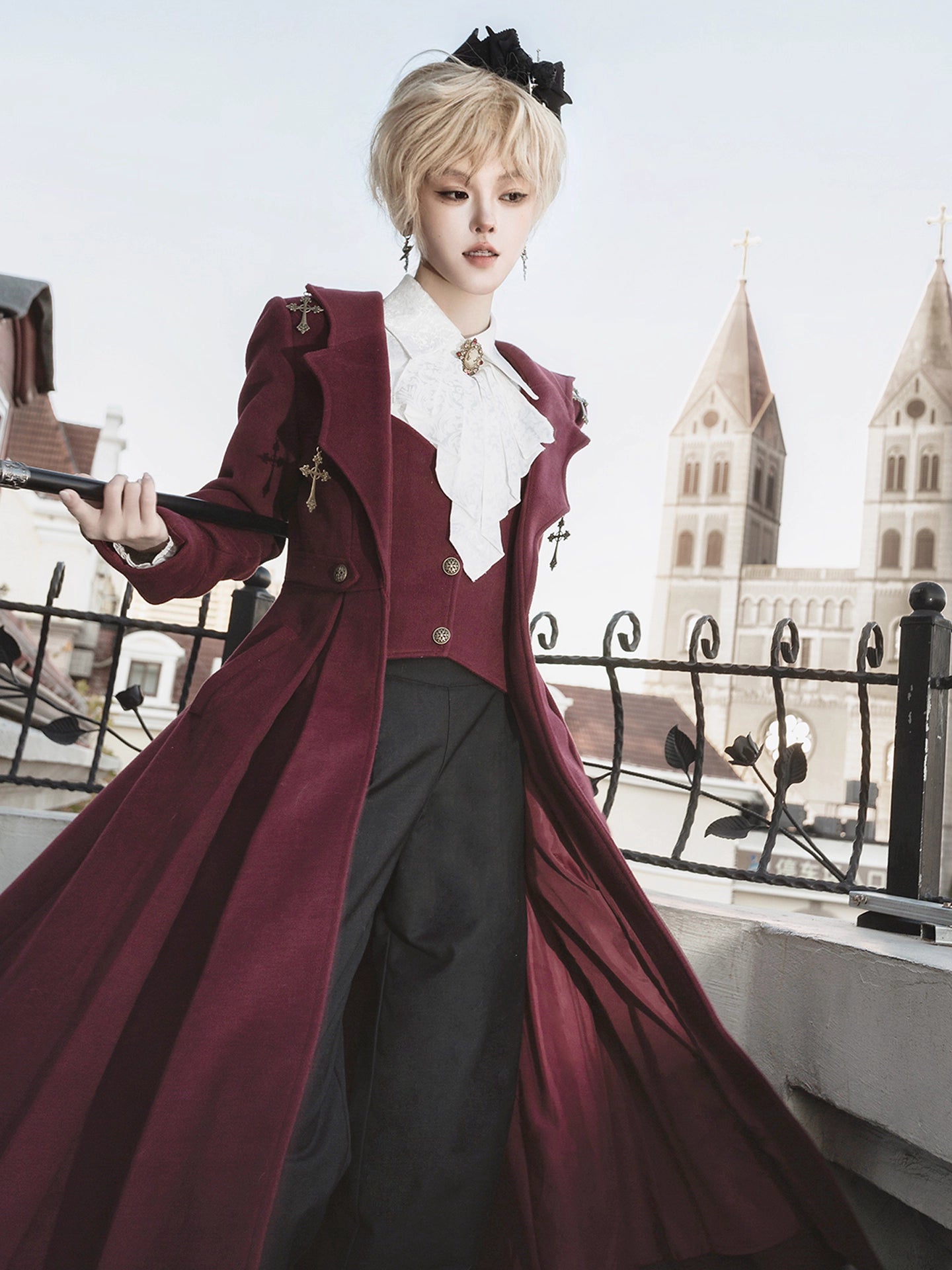 This Gothic-inspired ensemble reimagines the Dracula legend with a dark romantic aesthetic. The deep crimson palette and intricate medieval tailoring—featuring ruffled shirts, structured coats, and tailored trousers—evoke aristocratic elegance. Luxurious velvets and detailed metallic accents capture a haunting yet refined atmosphere, blending historical drama with Lolita fashion for a timelessly captivating&nbsp;statement.