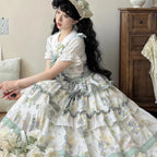 This Purple Green Classic Sweet Lolita JSK Dress is crafted to blend elegance with playful charm. The sleeveless design highlights the triple-layered ruffles and soft lace details, creating a light yet voluminous silhouette. Bowknot accents add a touch of sweetness, while the purple and green color combination offers a refreshing and unique vintage feel. Perfect for tea parties, daily outings, or themed events, this dress reflects timeless Lolita grace with a colorful twist.