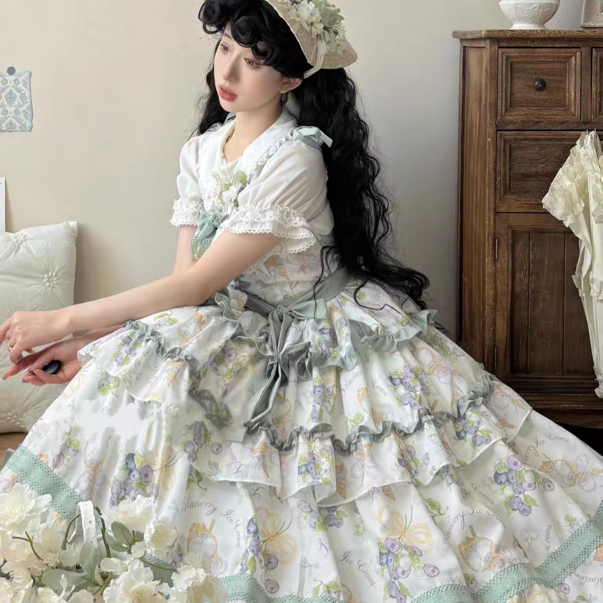 This Purple Green Classic Sweet Lolita JSK Dress is crafted to blend elegance with playful charm. The sleeveless design highlights the triple-layered ruffles and soft lace details, creating a light yet voluminous silhouette. Bowknot accents add a touch of sweetness, while the purple and green color combination offers a refreshing and unique vintage feel. Perfect for tea parties, daily outings, or themed events, this dress reflects timeless Lolita grace with a colorful twist.