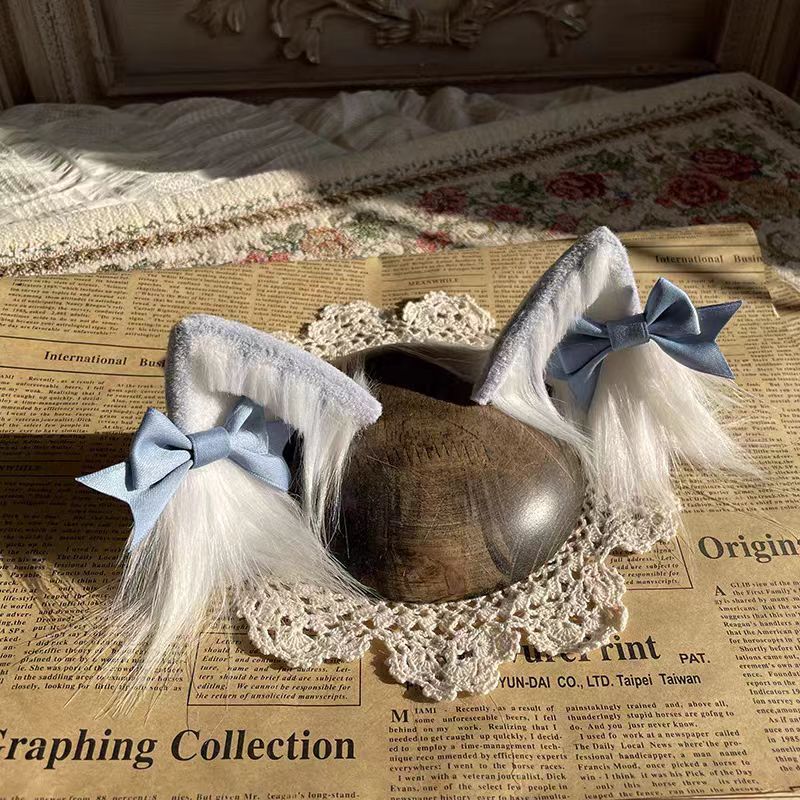 This Lolita Handmade Cat Ear Headband is designed to add a playful and charming touch to Lolita styling. Featuring soft tabby and calico patterns, the realistic animal ear design brings a cute, whimsical feel while maintaining elegance. Lightweight and comfortable, it pairs perfectly with sweet or cosplay-inspired Lolita looks. Ideal for tea parties, themed events, or photoshoots, this headband offers a unique blend of fun, craftsmanship, and Lolita charm.