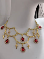 This Lolita Gold Layered Necklace embodies luxurious vintage elegance with a touch of European palace charm. Featuring multiple delicate layers, intricate cross details, and a refined gold finish, it highlights the neckline with sophistication. Perfect for tea parties, cosplay, or formal Lolita gatherings, this accessory enhances any classic or elegant outfit. Its ornate design blends traditional Gothic influences with regal Lolita aesthetics, creating a statement piece that exudes refinement and charm.