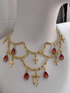This Lolita Gold Layered Necklace embodies luxurious vintage elegance with a touch of European palace charm. Featuring multiple delicate layers, intricate cross details, and a refined gold finish, it highlights the neckline with sophistication. Perfect for tea parties, cosplay, or formal Lolita gatherings, this accessory enhances any classic or elegant outfit. Its ornate design blends traditional Gothic influences with regal Lolita aesthetics, creating a statement piece that exudes refinement and charm.