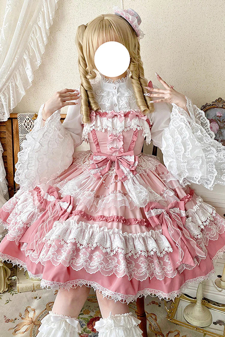 This Pink Sweet Gorgeous Lolita Doll JSK Dress is designed to capture a fairytale-like charm. Featuring a sleeveless cut with multi-layered ruffles, delicate lace, and playful bowknot accents, it creates a voluminous and dreamy silhouette. The soft pink tone enhances its doll-like sweetness, while the detailed craftsmanship adds elegance and grace. Perfect for tea parties, photoshoots, or special gatherings, this dress embodies the enchanting beauty of classic sweet Lolita fashion.