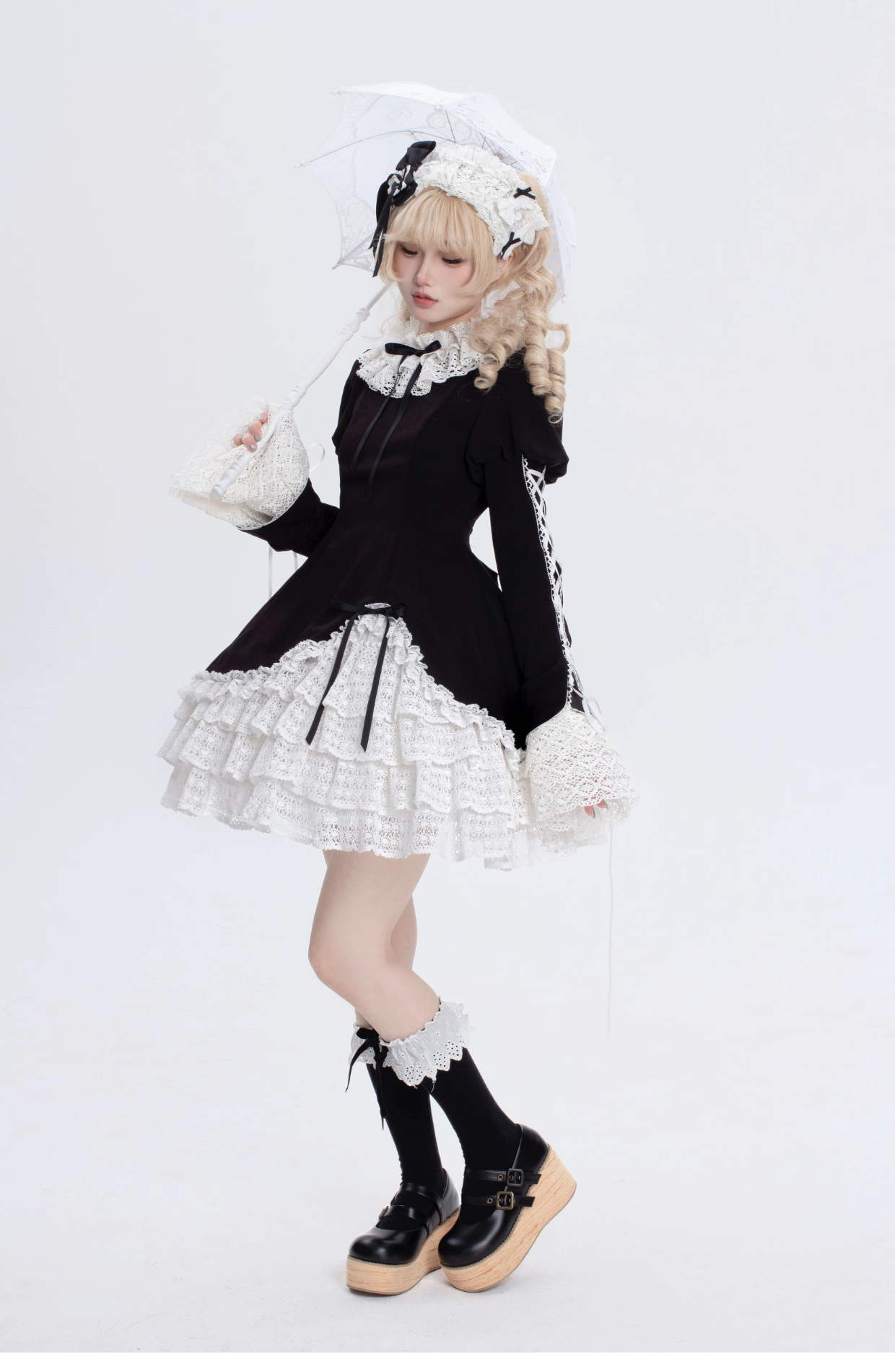 This Black White Doll Style Lolita Dress embodies a balance of sweetness and elegance with its refined lace trim and doll-like silhouette. The black and white palette creates a timeless contrast, while delicate details highlight the classic Lolita charm. Designed with a cute yet graceful aesthetic, it is perfect for tea parties, daily outings, or themed gatherings. A versatile piece that captures both playful innocence and the sophistication of traditional Lolita fashion.