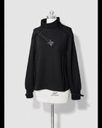 Design Concept:
This unisex Lolita-style black sweatshirt blends dark aesthetics with a modern cool flair. Featuring a sleek stand collar and a relaxed silhouette, it delivers both comfort and edge. The minimalist design is accented with subtle stylish details, making it versatile for casual wear, street fashion, or Ouji-inspired coordinates. Crafted for all seasons, this piece is ideal for layering or wearing as a statement top in everyday outfits.