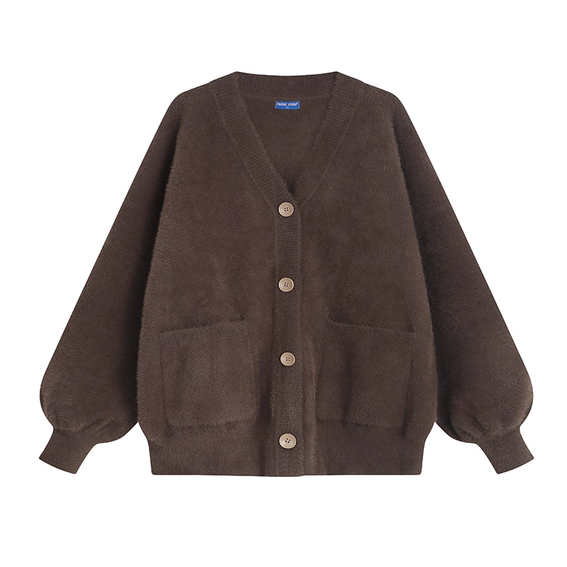 Designed for petite frames, this irresistibly plush cardigan wraps you in a cloud of softness with its fuzzy knit texture and playful pink hue. The cropped silhouette and cozy long sleeves balance warmth with effortless style, while the lightweight construction makes it a versatile layer for crisp days. A sweet yet practical piece that feels like a warm hug on chilly mornings.