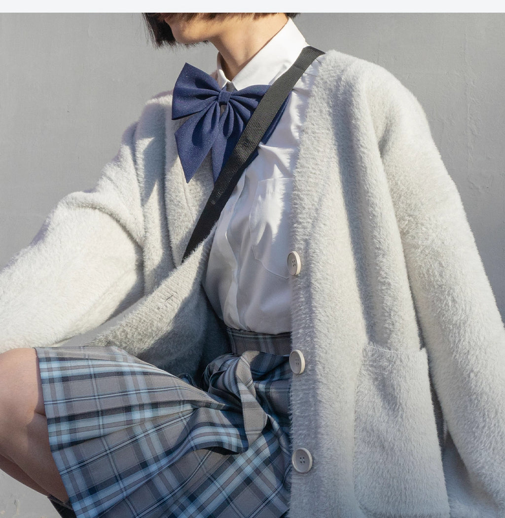 Designed for petite frames, this irresistibly plush cardigan wraps you in a cloud of softness with its fuzzy knit texture and playful pink hue. The cropped silhouette and cozy long sleeves balance warmth with effortless style, while the lightweight construction makes it a versatile layer for crisp days. A sweet yet practical piece that feels like a warm hug on chilly mornings.