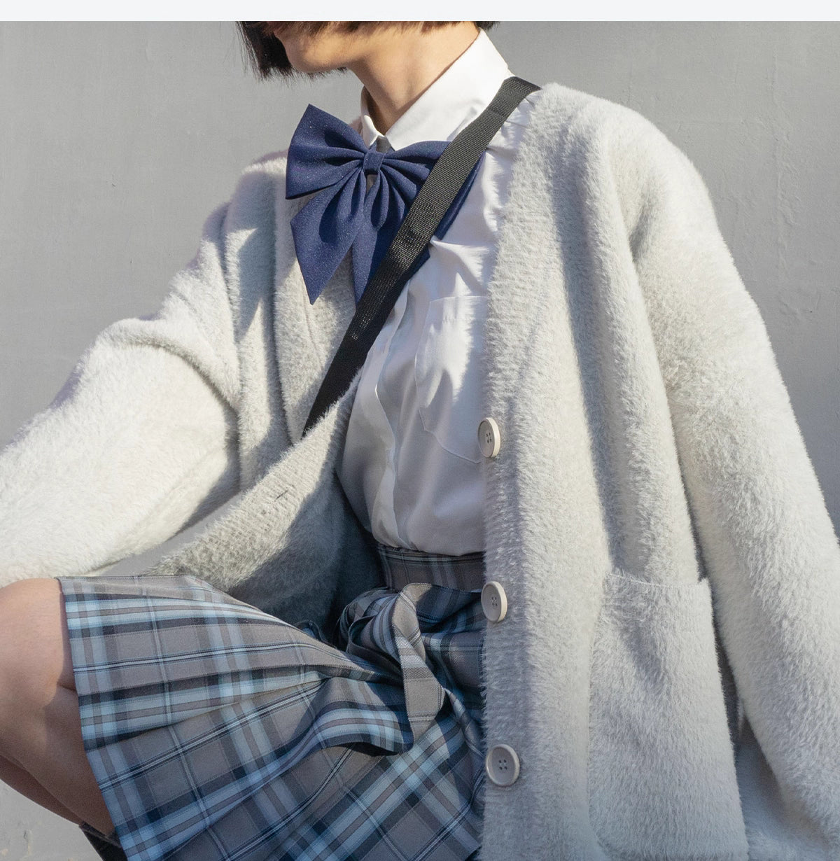 Designed for petite frames, this irresistibly plush cardigan wraps you in a cloud of softness with its fuzzy knit texture and playful pink hue. The cropped silhouette and cozy long sleeves balance warmth with effortless style, while the lightweight construction makes it a versatile layer for crisp days. A sweet yet practical piece that feels like a warm hug on chilly mornings.